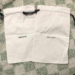 FREE WITH PURCHASE MEJURI POUCH